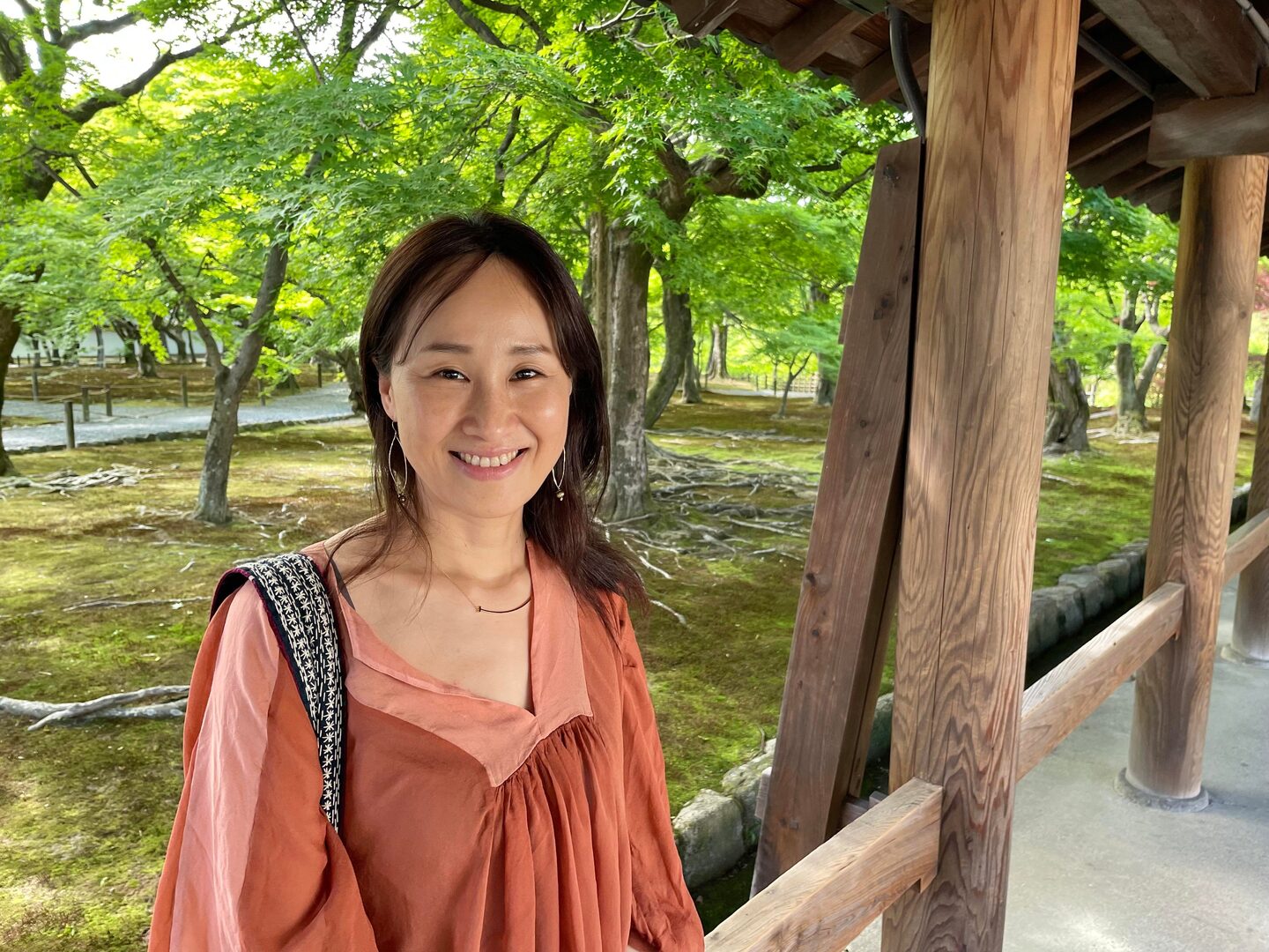 Tomomi Okubo outside smiling
